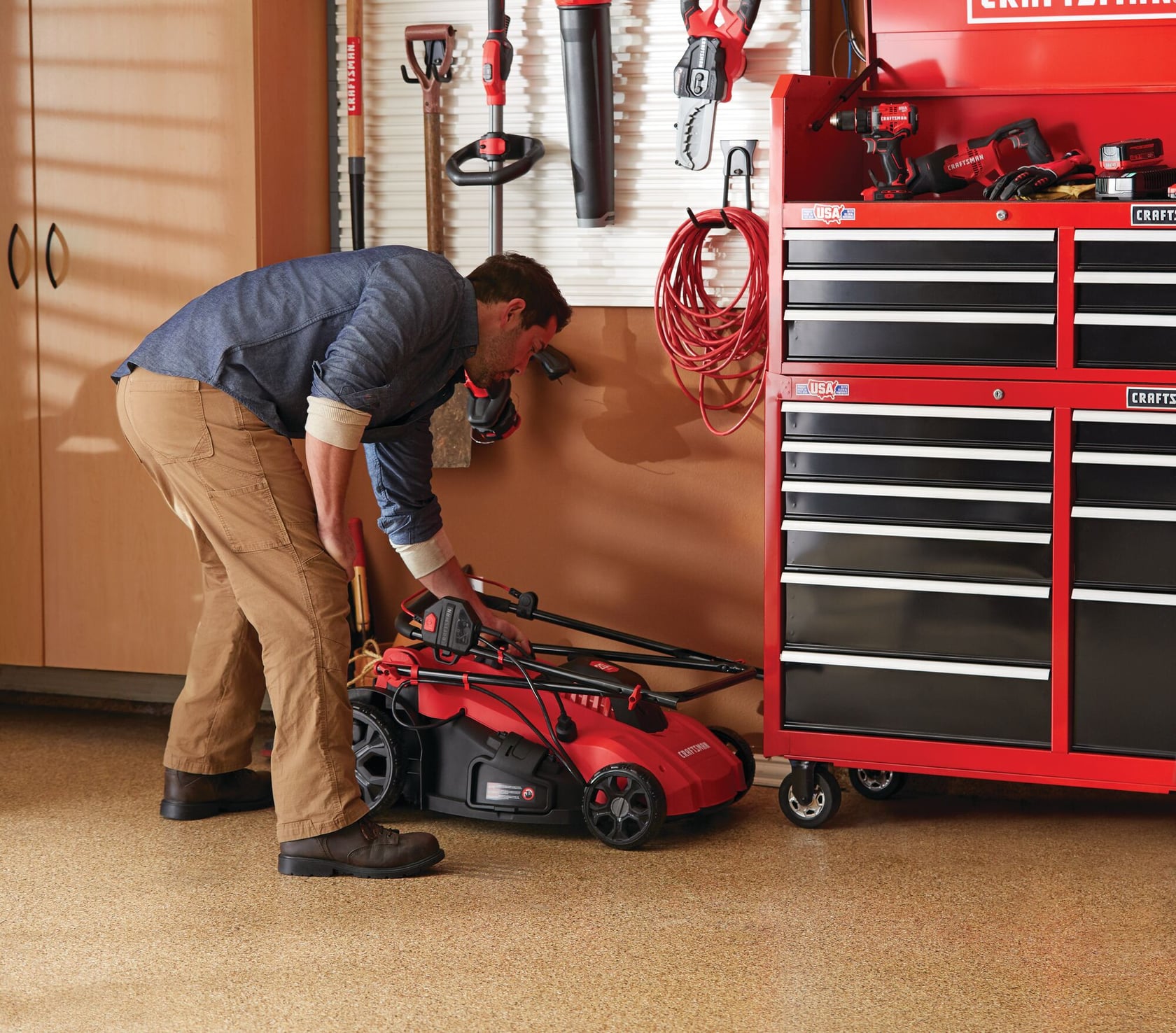 13 amp 20 inch corded 3 in 1 lawn mower being used by a person.