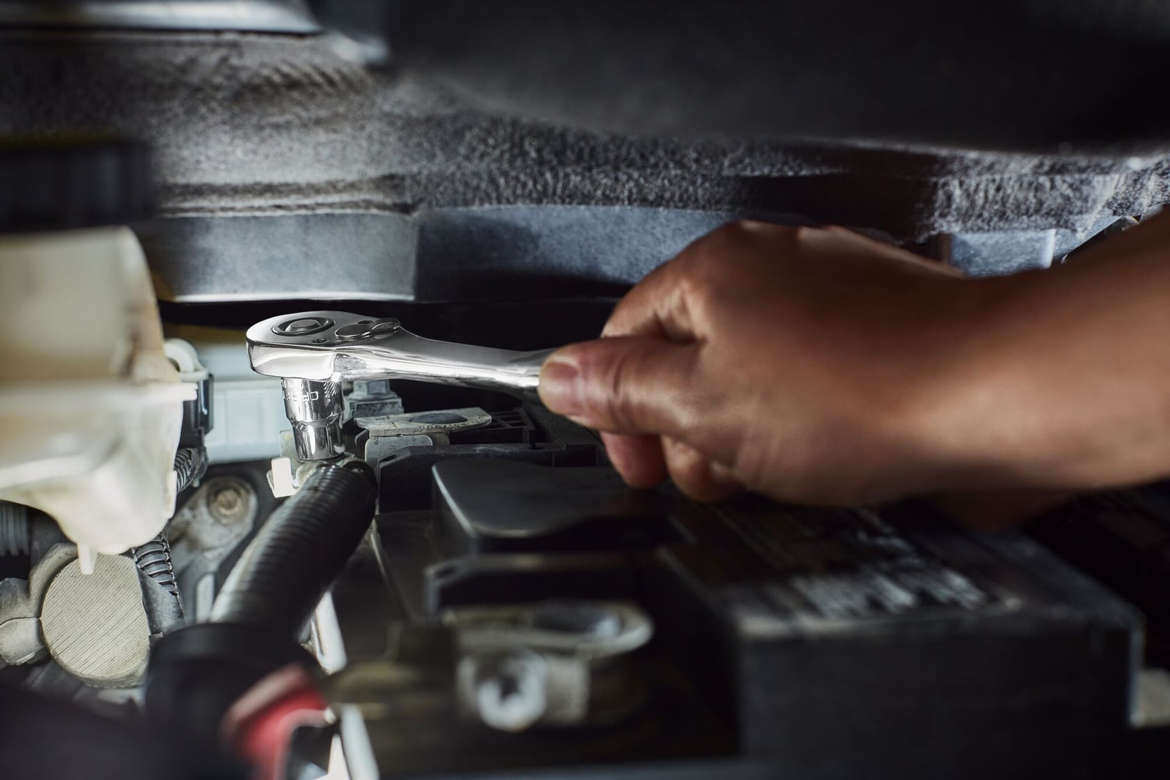 Photo of Craftsman ratchet wrench CMMT86722 being used on car engine part.