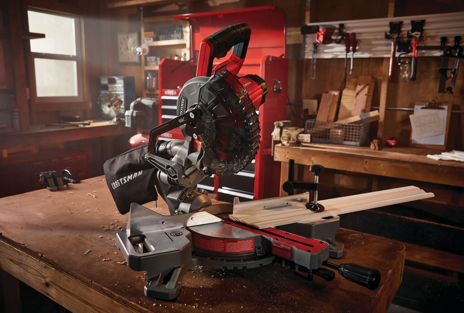 20 volt cordless 7 1 quarter inch sliding miter saw kit at a wooden table indoors.