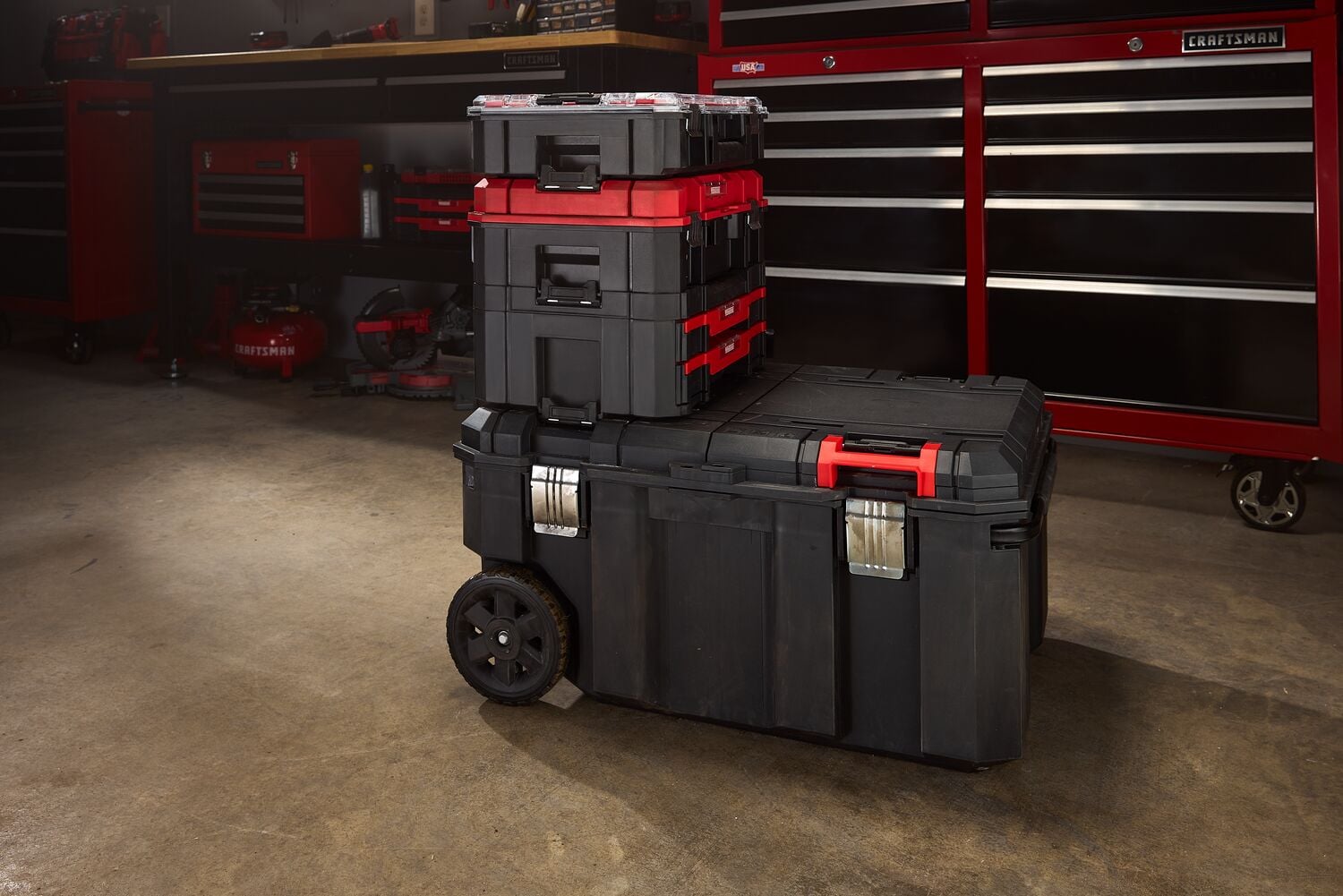 Photo of Craftsman rolling toolbox set CMST17870, black with red accents, stacked in a workshop setting.