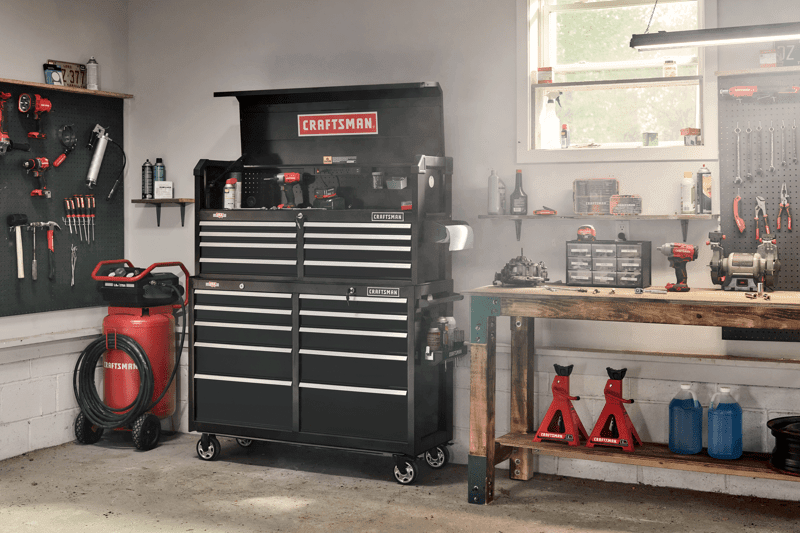 52 inch 8 drawer tool chest placed on top of rolling tool cabinet in workshop.