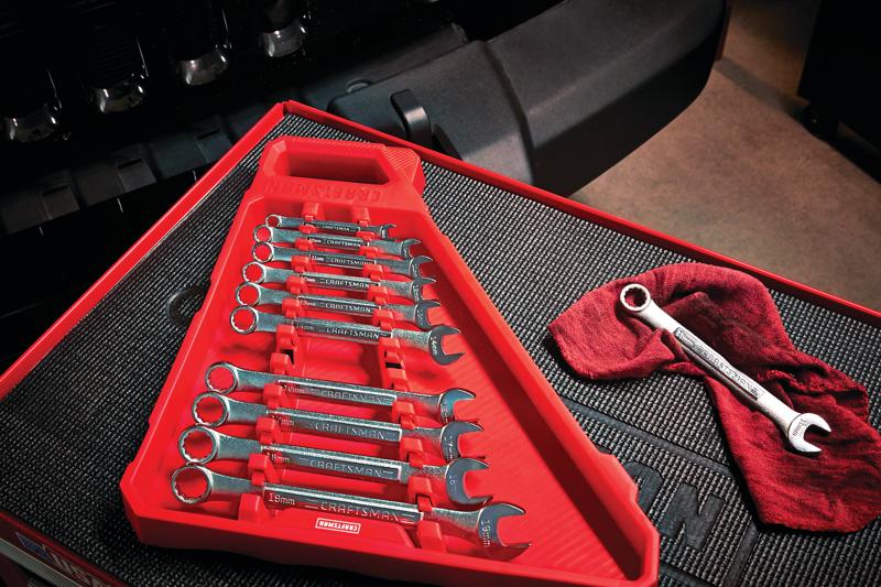 11 piece large metric combination wrench set placed on tool rack.
