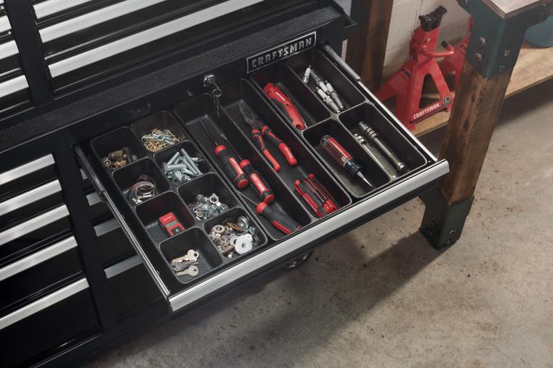 Tool Cabinet Drawer Tray Organizer Set containing tools and other items fitted in drawer of tool cabinet.