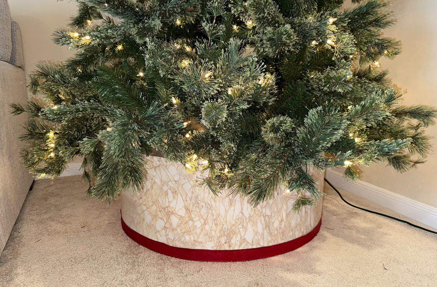 Custom marble tree skirt with a green christmas tree above