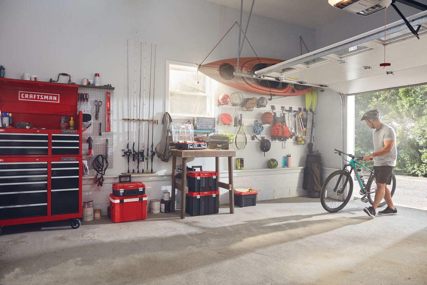 Photo of Craftsman tool storage cabinet and toolboxes CMST82602VT in organized garage setting.