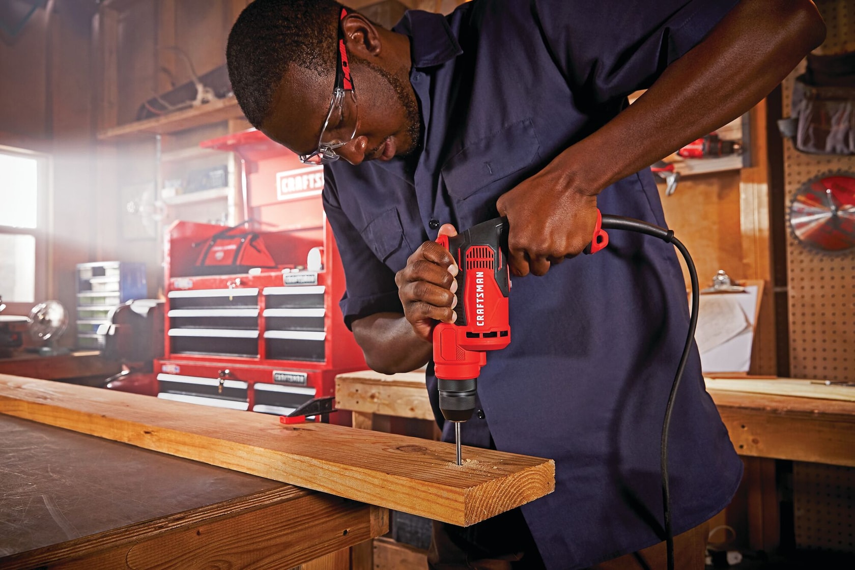 7 amp three eighth inch drill cum driver being used by a person.