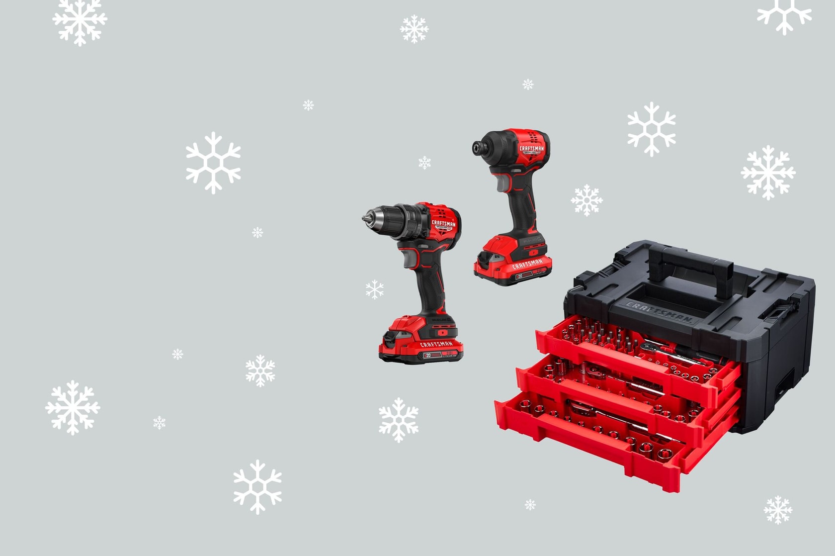 CRAFTSMAN drill, driver, and mech set with a grey background with white snowflakes around