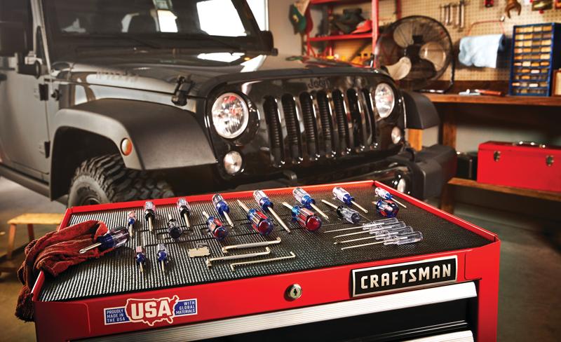 25 Piece Acetate ScrewDriver Set arranged on a working table placed in garage workshop.