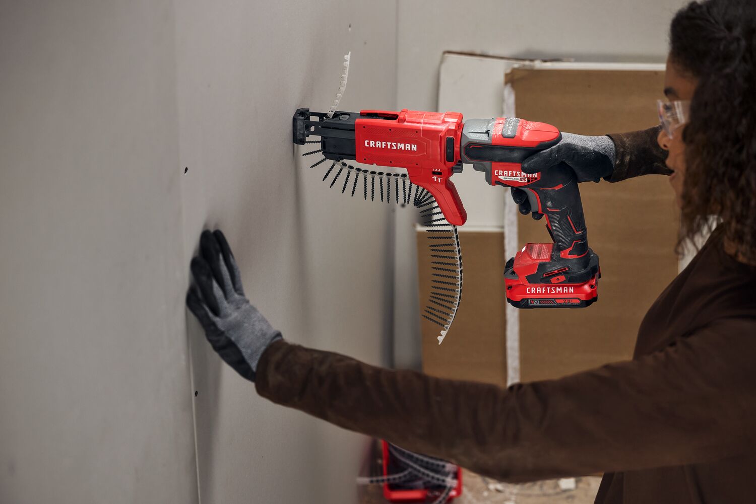 Craftsman V20 Brushless RP Drywall Screwgun fastening into drywall using collator attachment